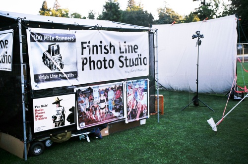 Finish Line Photo Studio at the Finish line, WS100. June 29-30, 2013. Placer HS, Auburn CA. Interior and exterior views. The previous pop-up had died an ugly death several weeks earlier in a 30mph wind-gust. I went back to the 1" EMT canopy arrangement with a new roof, and side-panels. The side panels are essential when the sun makes its merciless appearance late on Sunday morning, and people inexorably crowd in for shade.